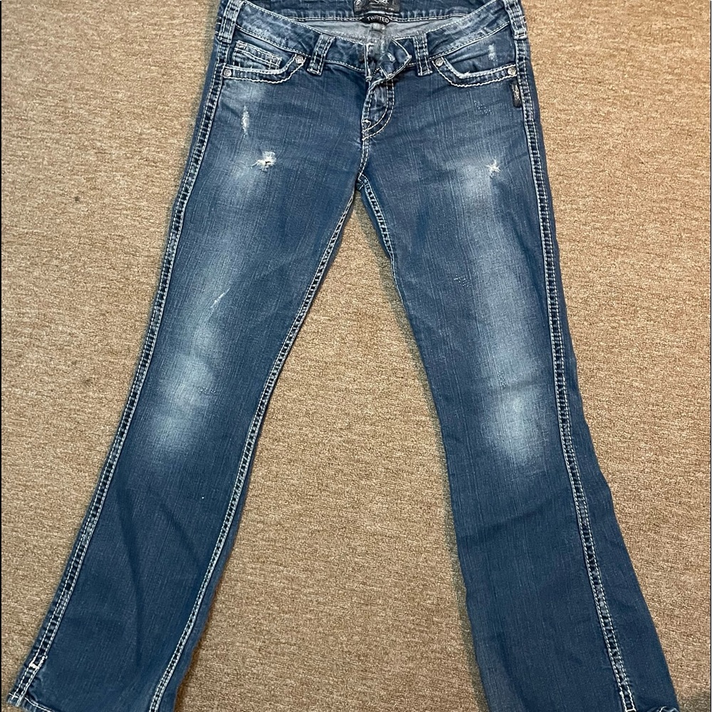 Silver twisted jeans. Boot cut, some wear on bottoms. Awesome jeans!
